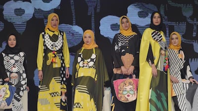 Designer Hannie Hananto combines black and yellow. Adek Berry / AFP Photo