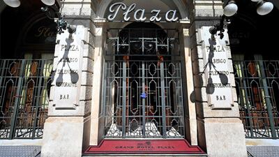 The closed main entrance of the Grand Hotel Plaza in Rome, during the country's lockdown aimed at curbing the spread of the COVID-19 infection, caused by the novel coronavirus. AFP / Alberto Pizzoli