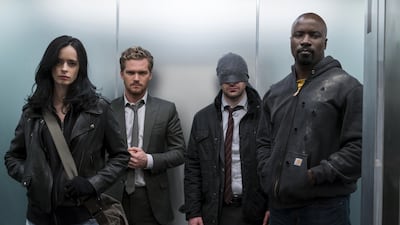 Jessica Jones (Krysten Ritter), Iron Fist AKA Danny Rand (Finn Jones), Matt Murdock (Charlie Cox), and Luke Cage (Mike Colter) Courtesy Netflix