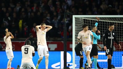 United players react to a missed chance by Marcus Rashford.