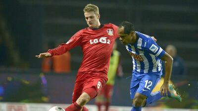 Many of Bayer Leverkusen's players, such as midfielder Lars Bender, left, have gained the attention of the German national team and are making their mark there, too, breaking the hold of Bayern Munich and Dortmund on the national side roster. Johannes Eisele / AFP