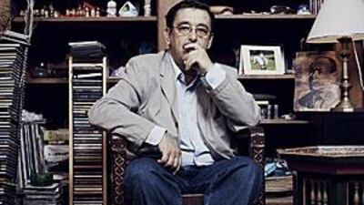 Bachir Ben Barka, son of on of the late Moroccan opposition figure Mehdi Ben Barka, at his home in Belfort, France. A portrait of his father is visible in the background on the right.