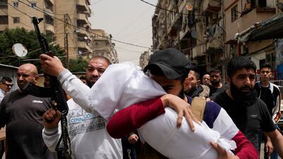 The funeral procession after seven people were killed when a boat packed with migrants sank at the weekend as the Lebanese navy tried to force it back to shore, in Tripoli, north Lebanon. AP