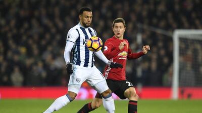 Matt Phillips of West Bromwich Albion, left, controls the ball while under pressure from Ander Herrera of Manchester United, right. Stu Forster / Getty Images