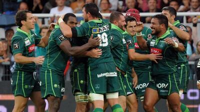 Pau players celebrate after shocking Toulouse in the French Top 14. Gaizka Iroz / AFP