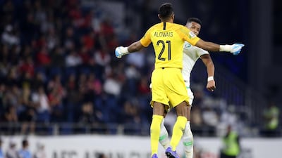 Saudi Arabia goalkeeper Mohammed Alowais and teammate Ali Hadi Albulayhi celebrate. EPA