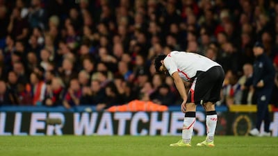 Luis Suarez reacts following Liverpool's 3-3 draw against Crystal Palace on May 5, 2014. Jamie McDonald / Getty Images
