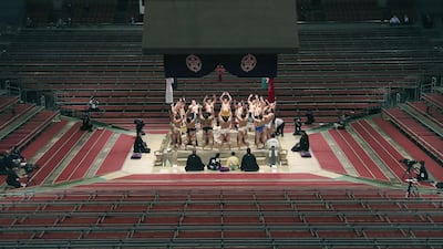 No spectators are present to see Sumo wrestlers hold a Dohyo ring entering ceremony at the Spring Grand Sumo Tournament in Osaka, Japan, on Sunday March 8. Reuters
