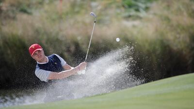 Justin Thomas, of the United States, hits from a bunker on the seventh hole during the four-ball golf matches on the third day of the Presidents Cup at Liberty National Golf Club in Jersey City, NJ. Julio Cortez / AP Photo