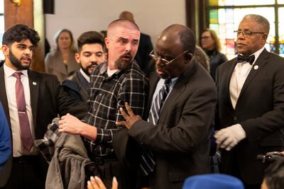 A protester against the Israel-Gaza war is removed from the venue as Mr Biden delivers his speech at the Mother Emanuel Church in South Carolina. AP