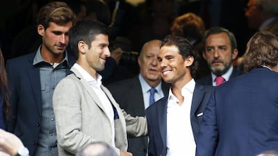 Novak Djokovic, left, and Rafael Nadal, right, enjoy themselves at the Bernabeu on Wednesday night. Juan Carlos Hidalgo / EPA