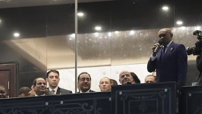 Egypt President Abdel Fattah al-Sisi (L) looks on as Confederation of African Football President Ahmed Ahmed makes an address before the 2019 Africa Cup of Nations match between Egypt and Zimbabwe at Cairo International Stadium. EPA