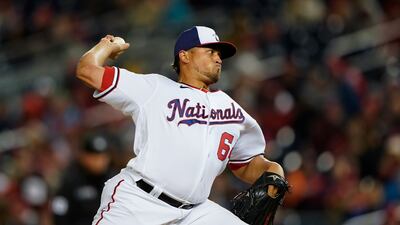 Washington Nationals relief pitcher Victor Arano throws a pitch to the New York Mets during the fifth inning of an opening day baseball game at Nationals Park in Washington. AP