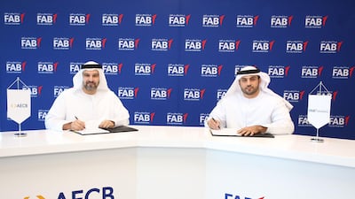 Jasim Al Ali, chief executive of FAB Properties left, and Marwan Lutfi, chief executive of AECB. FAB Properties said the bureau's credit services will help the company assess “the risk associated with tenants fulfilling their payment obligations”. Courtesy Fab Properties