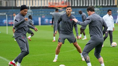 Kylian Mbappe trains with Lionel Messi. AP