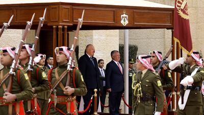 King Abdullah II and King Harald ) look on during the welcome ceremony in Amman, Jordan. EPA