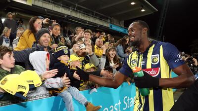 Usain Bolt greets during a pre-season friendly for Central Coast Mariners. AFP