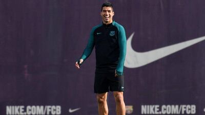 Luis Suarez of Barcelona smiles during training. David Ramos / Getty Images