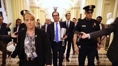 US Treasury Secretary Steven Mnuchin leaves the offices of Minority Leader Charles Schumer as negotiations continued into the night on a $2 trillion economic stimulus in response to the coronavirus pandemic. Democrats twice blocked the package but reached the Senate and Treasury Department reached and agreement on Wednesday. AFP