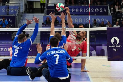 Morteza Mehrzadselakjani competed with the Iranian team against Ukraine in the sitting volleyball men's preliminary round pool B match on Friday. AFP.