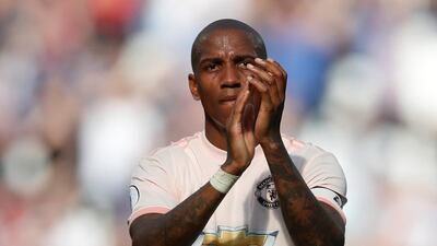Manchester United player Ashley Young applauds the fans after the Premier League defeat to West Ham United. Matthew Childs / Reuters