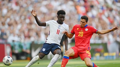 England's Bukayo Saka is challenged by Max Llovera of Andorra. Getty