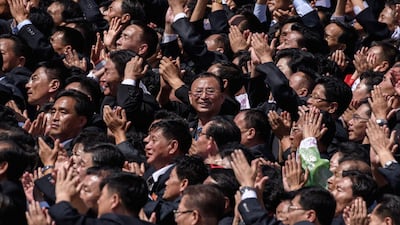 Participants cheer as they look towards a balcony from where North Korea's leader Kim Jong Un was watching, during a military parade and mass rally on Kim Il Sung square in Pyongyan. AFP