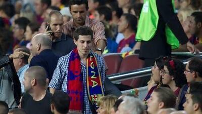 Israeli soldier Gilad Shalit, centre, arrives to take a seat in the grandstand during the match between Barcelona and Real Madrid last October at the Camp Nou. Quique Garcia / AFP