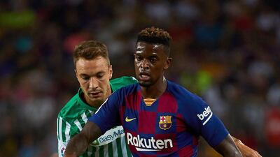Barcelona's defender Nelson Semedo shields the ball from Betis forward Loren Moron, who would later score to make it 5-2. EPA