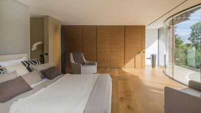 The first floor contains four of the house’s five main bedrooms, including a principal bedroom with major bathroom and two large balconies. Courtesy Savills and TK International