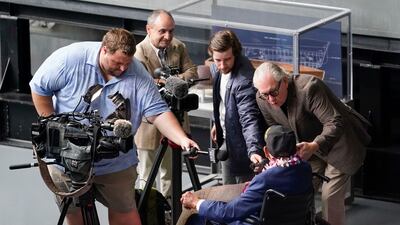 Mr Eskenazi speaks with reporters at the event