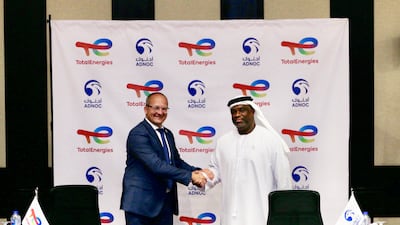 Bader Al Lamki, chief executive of Adnoc Distribution (right) and Thierry Pflimlin, president, Marketing & Services at TotalEnergies, sign the agreement for acquisition of 50 per cent of TotalEnergies Marketing Egypt. Photo: Adnoc