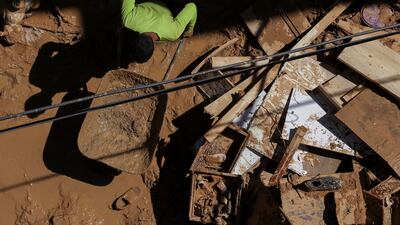A man clears mud from a house that was damaged by the fatal floods in Derna, Libya. Reuters