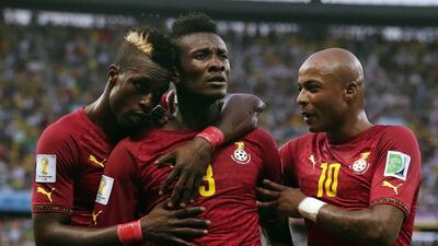 Ghana's Asamoah Gyan, centre, celebrates with his teammates after putting Ghana in front during their Group G match with Germany. The game ended 2-2. Marcio Jose Sanchez / AP Photo