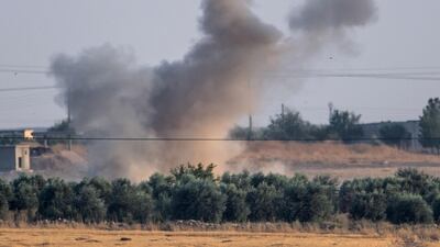 Smoke rises from the Syrian town of Tal Abyad after Turkish bombings, in a picture taken from the Turkish side of the border near Akcakale in the Sanliurfa province on October 9, 2019. Turkey launched an assault on Kurdish forces in northern Syria on October 9 with air strikes and artillery fire reported along the border. The Turkish President announced the start of the attack on Twitter, labelling it "Operation Peace Spring". It triggered criticism from Western countries who have allied with the Kurdish-led Syrian Democratic Forces (SDF) against the Islamic State jihadist group (IS). / AFP / BULENT KILIC