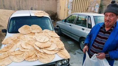 Bread is put out to cool in a working class neighbourhood in Damascus. Economic reforms have begun to hit the country's poor.