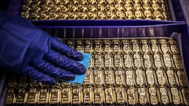 Branded gold bars from a recognised financial institution help increase transparency, quality assurance and convenience for buyers. AFP