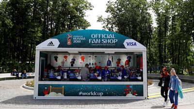 A fan shop outside the Luzhniki Stadium before the opening World Cup match between Russia and Saudi Arabia. Despite the huge spend, the host country is unlikely to register any significant economic gain. Kai Pfaffenbach/Reuters