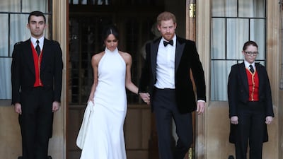 Meghan, Duchess of Sussex and Prince Harry leave Windsor Castle after their wedding to attend an evening reception at Frogmore House on May 19, 2018 in Windsor, England. Getty Images