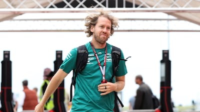 Aston Martin's Sebastian Vettel arrives at the paddock. PA