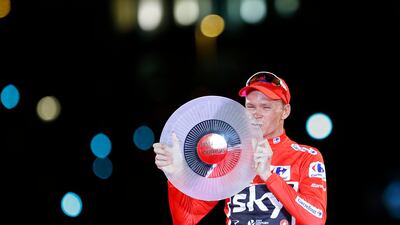 Britain's Chris Froome celebrates on podium after winning the Spanish Vuelta cycling race