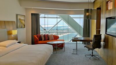 The rooms are drenched in sunlight thanks to the floor to ceiling glass wall on one side