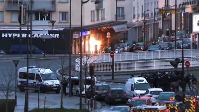 A screengrab taken from an AFP TV video shows members of the French police special forces launching an assault at a kosher grocery store in Porte de Vincennes, eastern Paris, on January 9, 2015, where a gunman took several people hostage. Gabrielle Chatelain / AFP
