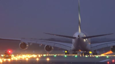 The car gives chase as the Emirates A380 prepares for takeoff. Courtesy Emirates
