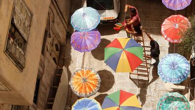 Palestinians hang umbrellas in a street ahead of the Muslim fasting month of Ramadan in the West Bank city of Nablus. Abed Omar Qusini / Reuters