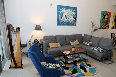 The drawing room in Clemence Powney's home. Ms Powney is an artist and also plays the harp. Pawan Singh / The National