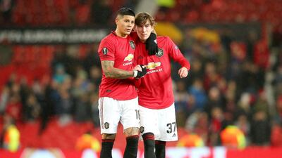 James Garner, rifght, and Marcos Rojo of Manchester United celebrate victory. Getty