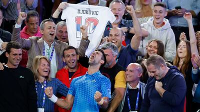 Novak Djokovic celebrates with his team including his mother, Dijana, second left, after defeating Stefanos Tsitsipas. AP