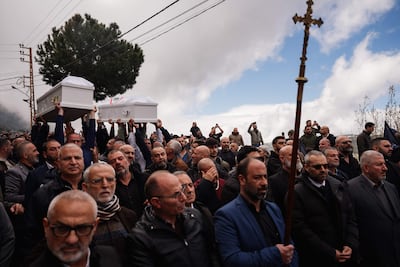 Mourners at the funeral of Pierre Mouawad, an official from the anti-Hezbollah Lebanese Forces, who was killed in an Israeli attack. AFP