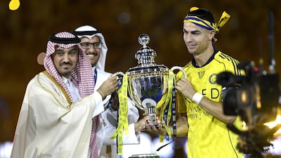 Al Nassr captain Cristiano Ronaldo receives the Saudi Pro League trophy. EPA